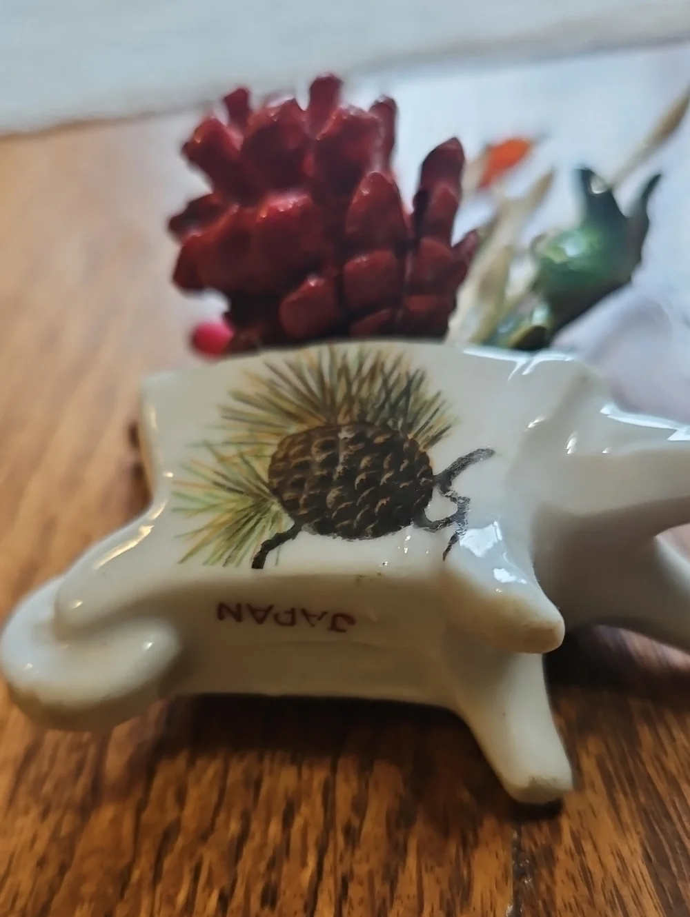 Vintage Pinecone Wheelbarrow with Colorful Accents